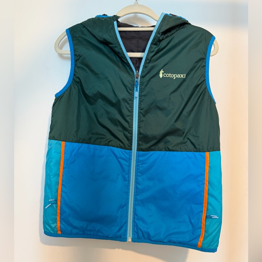 Women’s reversible cotopaxi Green and Blue Hooded Puffer Vest with Orange Trim